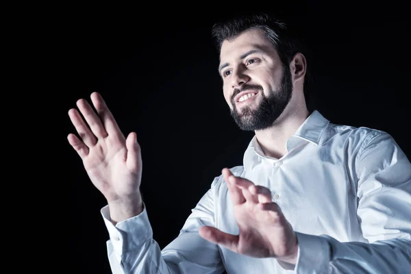 Happy delighted man using transparent screen — Stock Photo, Image