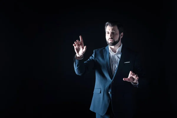 Serious bearded businessman pointing with his finger — Stock Photo, Image