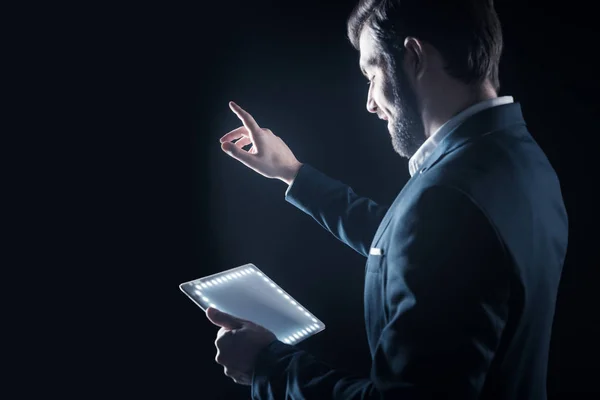 Cheerful happy businessman looking at his tablet — Stock Photo, Image