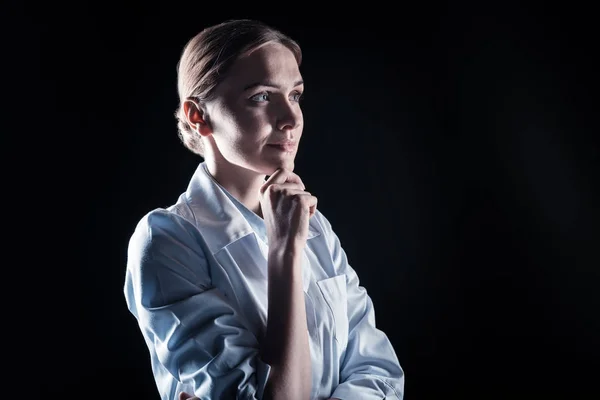 Smart thoughtful woman holding her chin — Stock Photo, Image