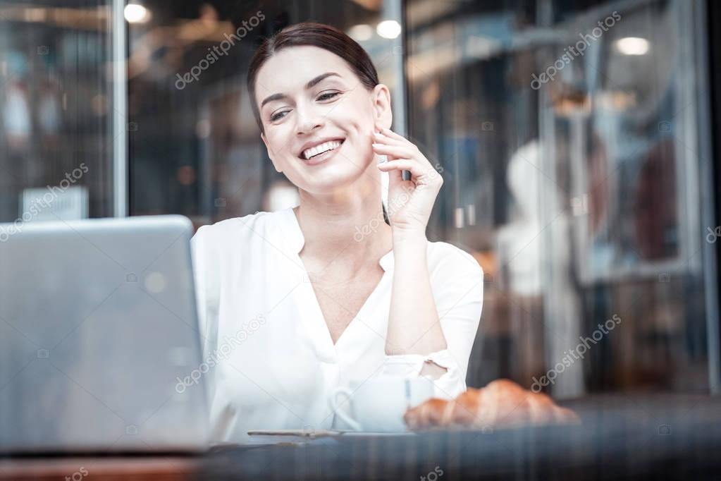 Cheerful businesswoman having video conference
