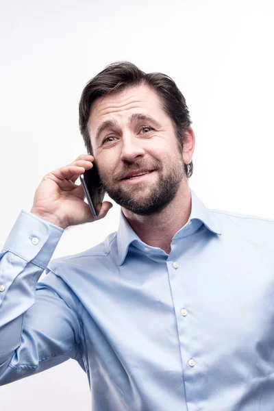 Pleasant bearded man having a phone call — Stock Photo, Image