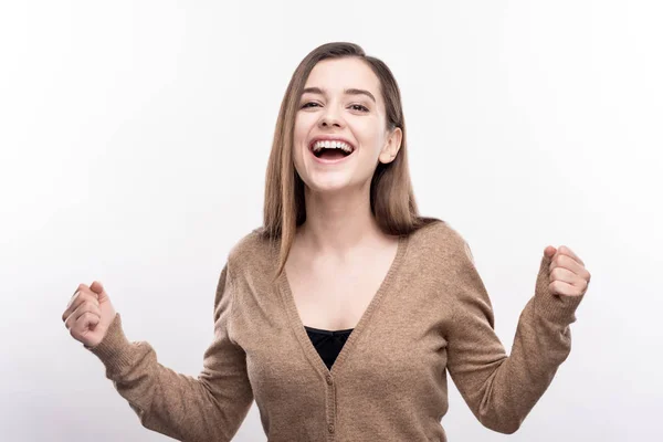 Cheerful pretty woman reacting happily to good news — Stock Photo, Image