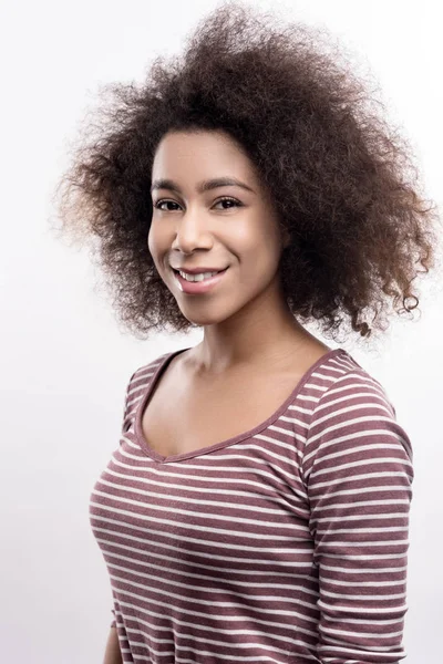 Portrait of cute curly woman in striped pullover — Stock Photo, Image