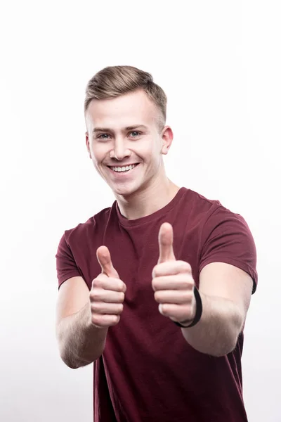 Pleasant fair-haired man showing thumbs up — Stock Photo, Image