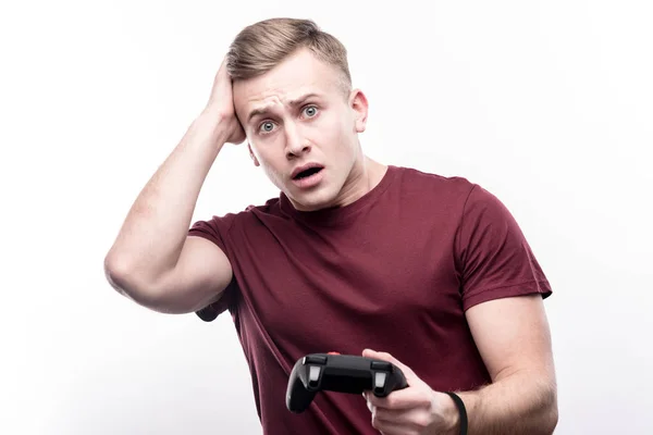 Fair-haired young man being frustrated about loss in game — Stock Photo, Image