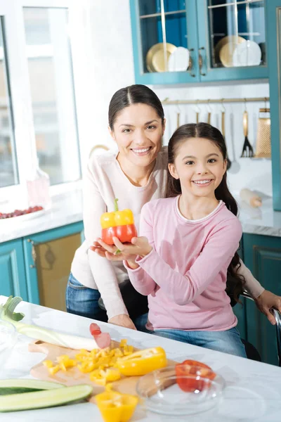 Delighted mother and daughter cooking together — Stock Photo, Image