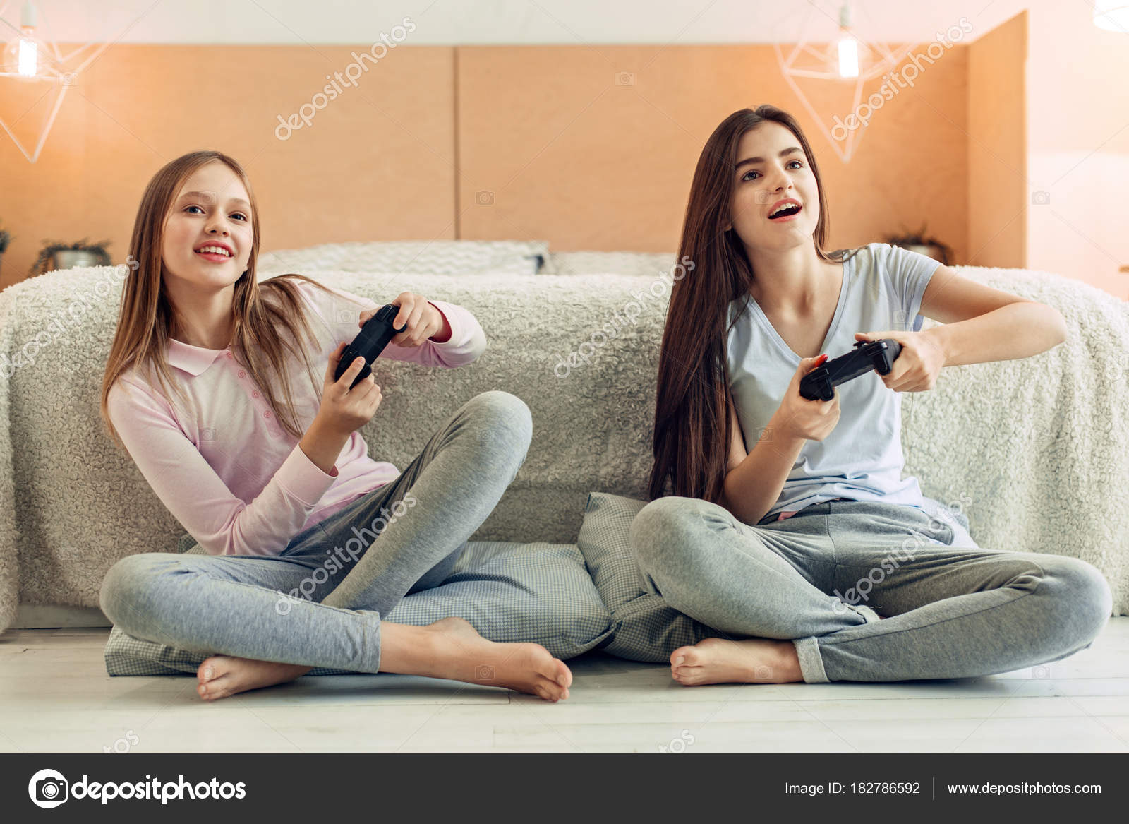 depositphotos_182786592-stock-photo-two-teenage-sisters-playing-video.jpg