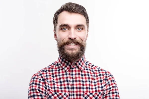 Portrait of charming bearded man in checked shirt — Stock Photo, Image