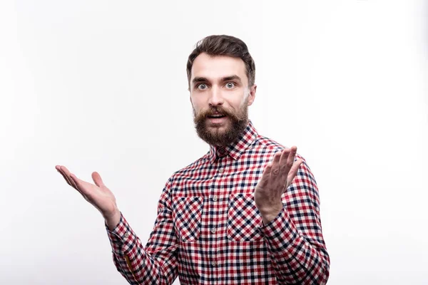 Bearded young man looking shocked about something — Stock Photo, Image