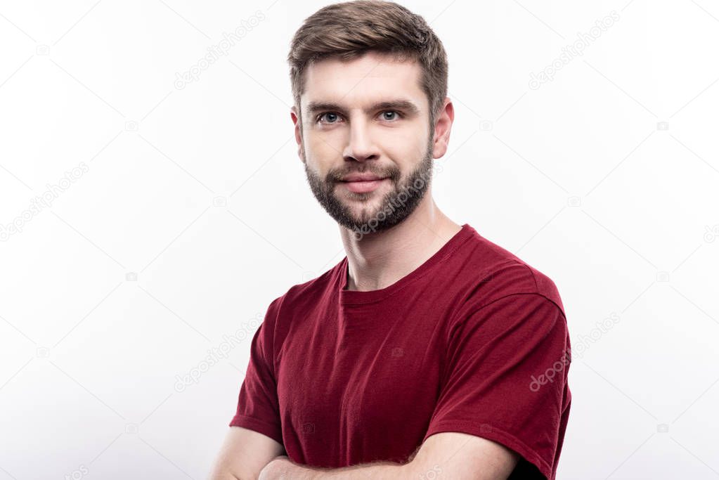 Attractive man folding his arms and posing