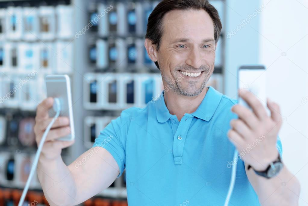 Delighted man feeling happiness in shop