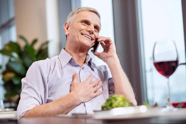 Glad mature man receiving call — Stock Photo, Image