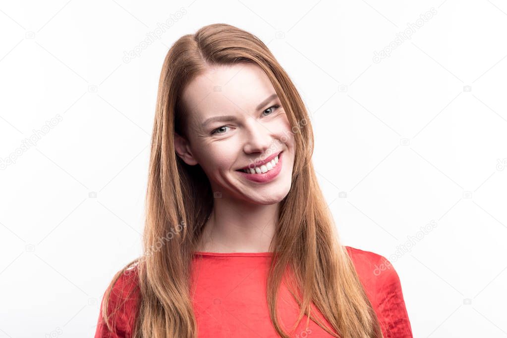 Portrait of beautiful ginger-haired smiling woman