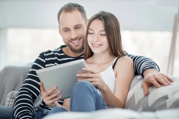 Loving couple relaxing together on the couch