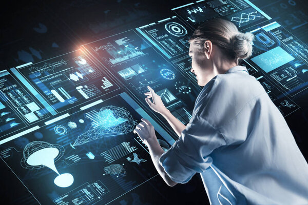 Reliable person smiling while looking at the information on the screen