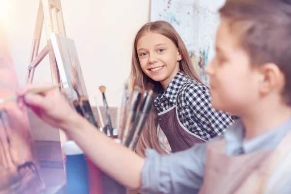 Smiling children painting on art canvas — Stock Photo, Image