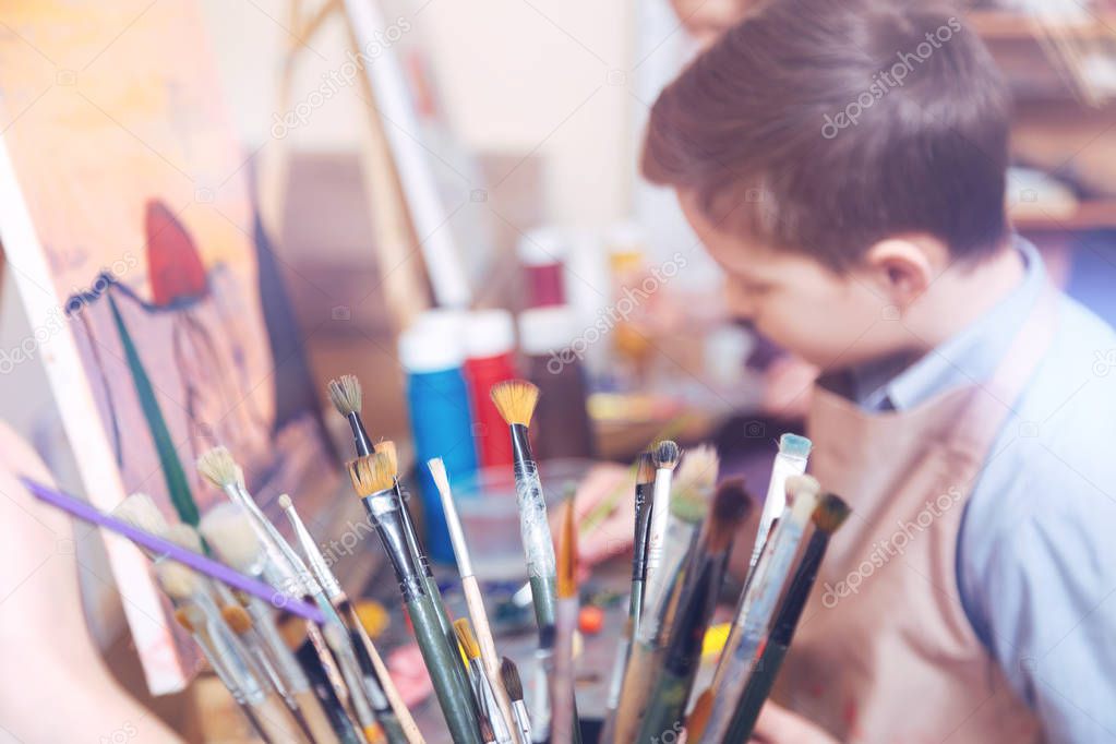 Chestnut haired youngster in art studio