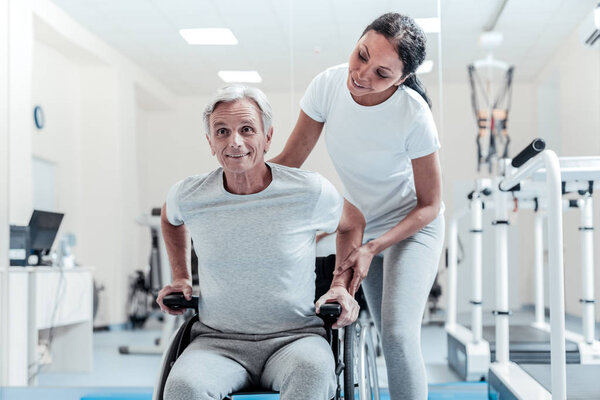 Content old man sitting in a wheelchair