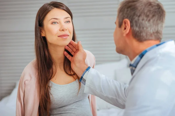 Cheerful mother to be visiting her doctor — Stock Photo, Image