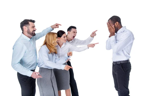 Wicked colleagues mocking at their co-worker — Stock Photo, Image
