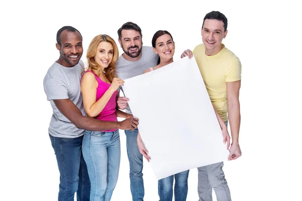 Smiling best friends holding a placard — Stock Photo, Image