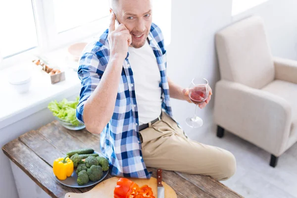 Attractive handsome man answering phone call — Stock Photo, Image