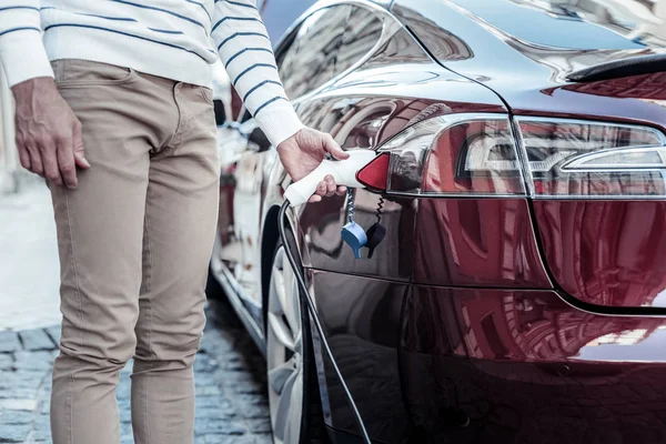 Close up of a fuel nozzle being used at the gas station — Stock Photo, Image