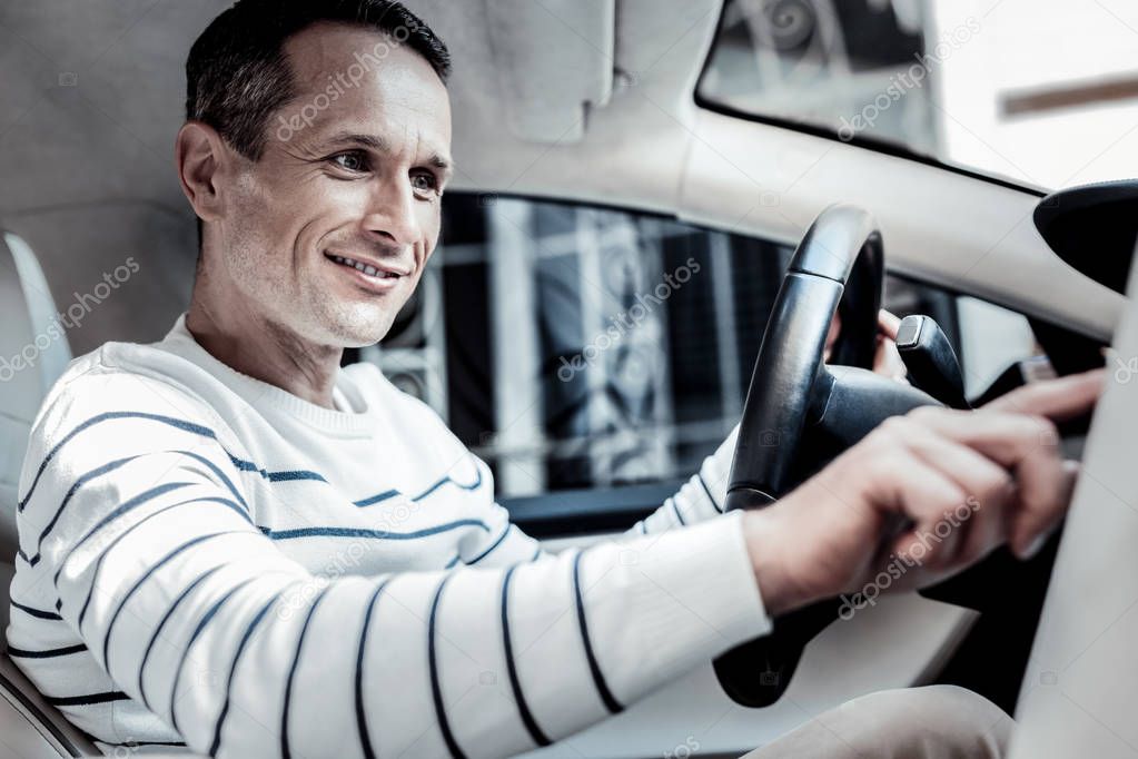 Positive joyful man pressing a button