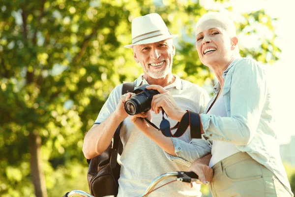 Positive elderly couple having a walk — Stock Photo, Image