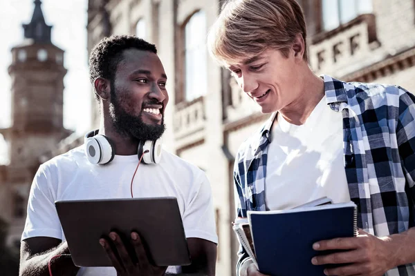 Joyful nice man holding a tablet — Stock Photo, Image