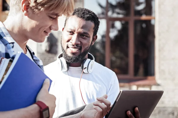 Delighted nice man looking at his friend — Stock Photo, Image