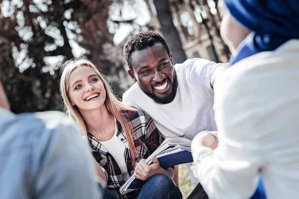 Happy young woman holding her notes — Stock Photo, Image