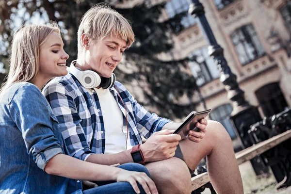 Nice positive students using a tablet — Stock Photo, Image