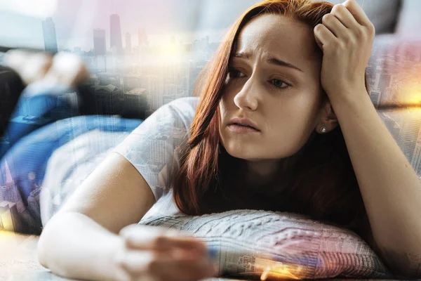 Young upset woman looking gloomy while resting alone — Stock Photo, Image