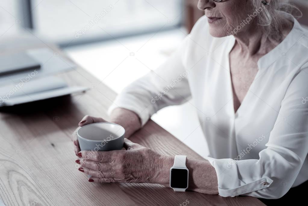 Close up of female hands that holding cup