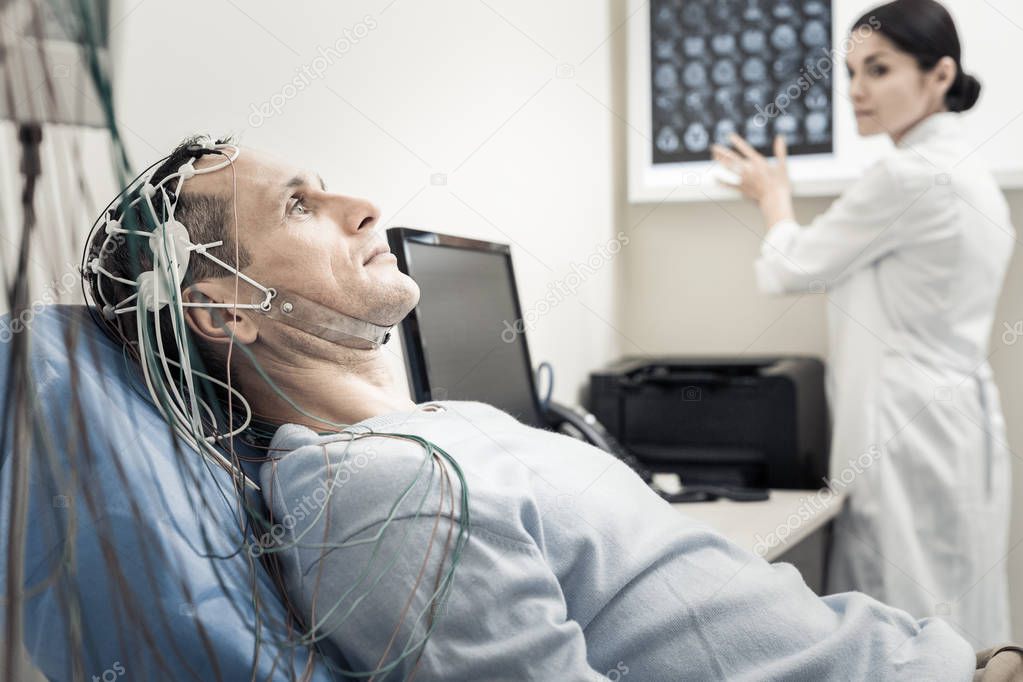 Nice handsome man wearing electronic wires