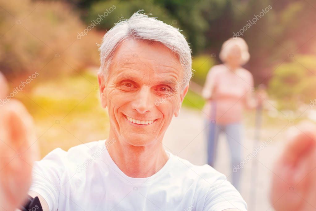 Portrait of cheerful elderly man