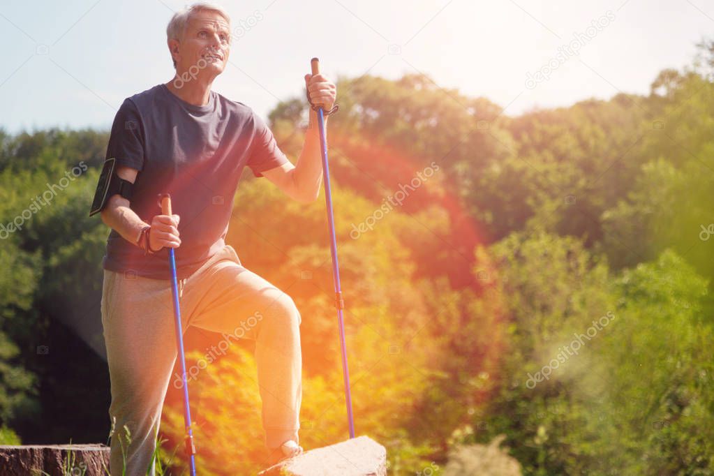 Positive elderly man reaching his destination