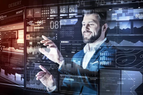 Positive man smiling while doing the easiest part of work — Stock Photo, Image