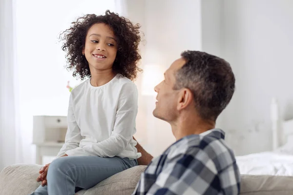 Cheerful girl looking at her father — Stock Photo, Image