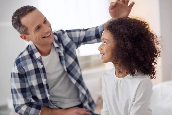 Smiling father talking with his daughter — Stock Photo, Image