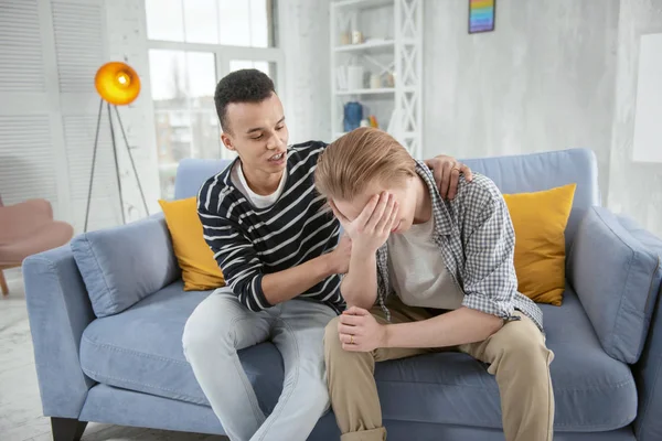 Melancholy gay couple sharing feelings — Stock Photo, Image