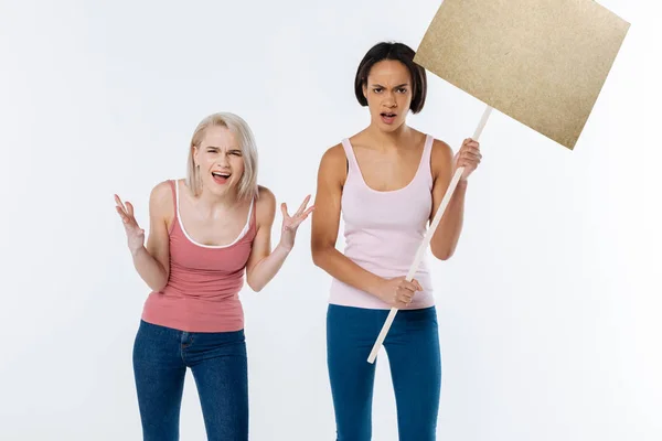 Angry young women looking at you — Stock Photo, Image