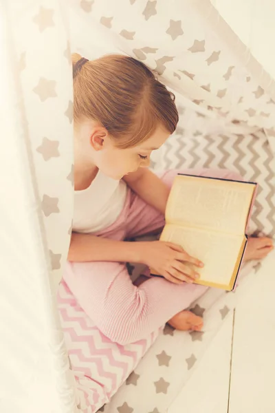 Top view of a girl reading a book — Stock Photo, Image