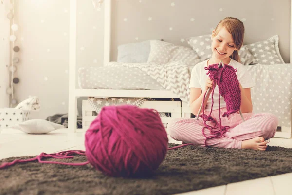 Happy cute girl knitting — Stock Photo, Image