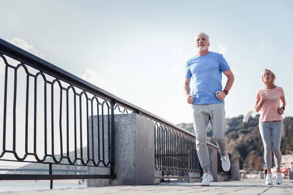 Confident unshaken man looking straight and running. — Stock Photo, Image