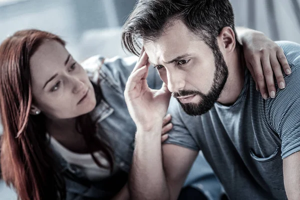 Deep upset man touching head and looking down. — Stock Photo, Image