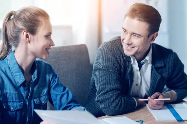 Positive colleagues looking at each other — Stock Photo, Image