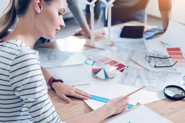 Attentive designer drawing straight lines — Stock Photo, Image